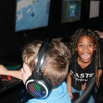 Children enjoy our coding program in the computer room at the North Brandon YMCA.